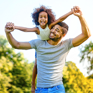 young adult male carrying daughter