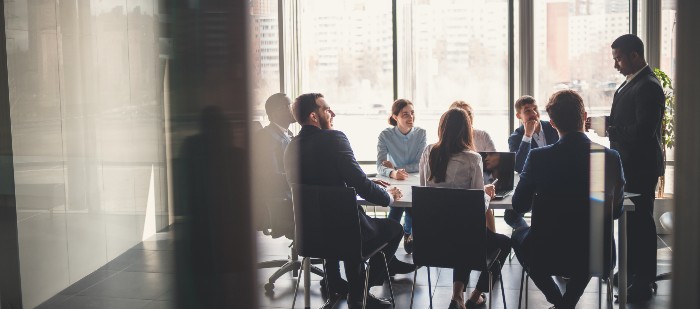 Several professionals in a business meeting about automated accounts payable