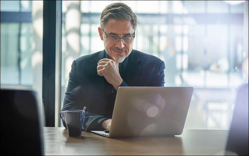 man looking at laptop