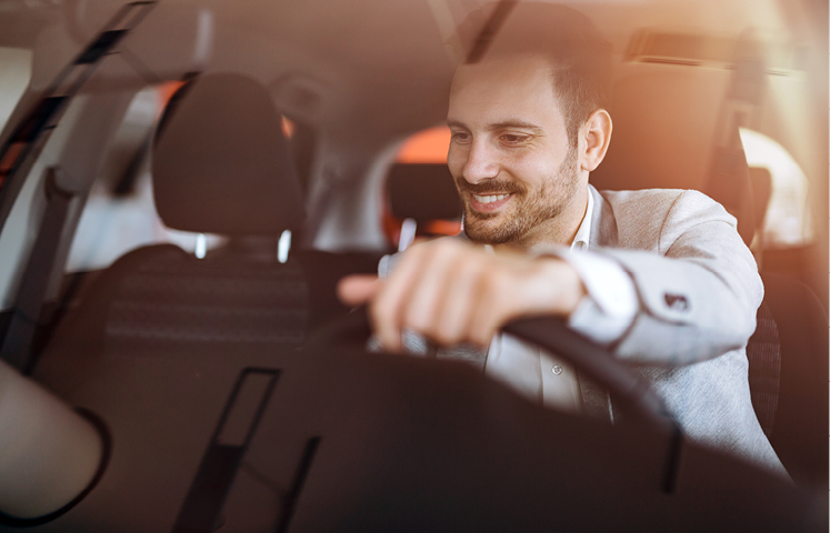 man driving car