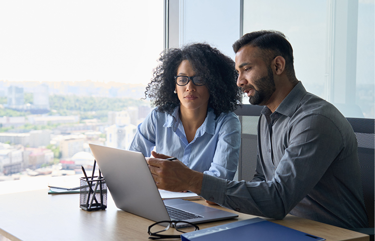 two people looking at computer screen