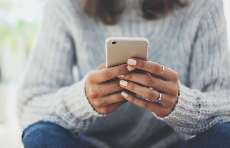 woman holding iphone