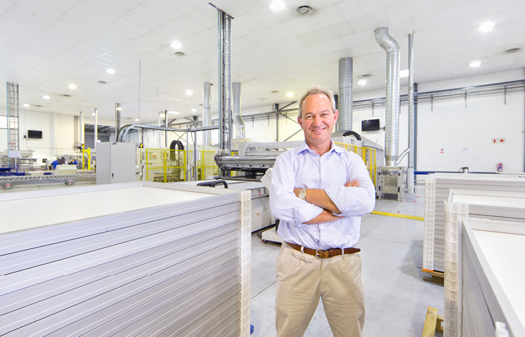 man standing in front of factory floor