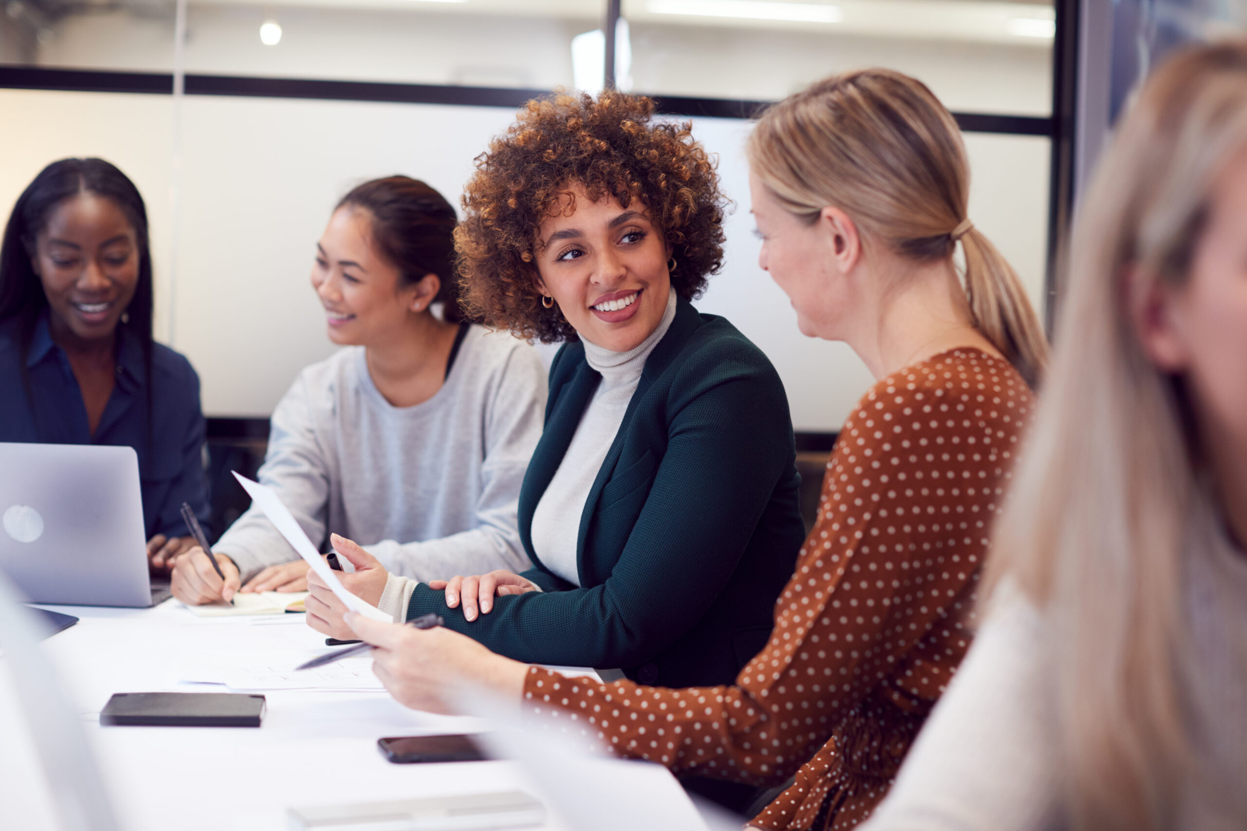 Group,Of,Businesswomen,Collaborating,In,Creative,Meeting,Around,Table,In