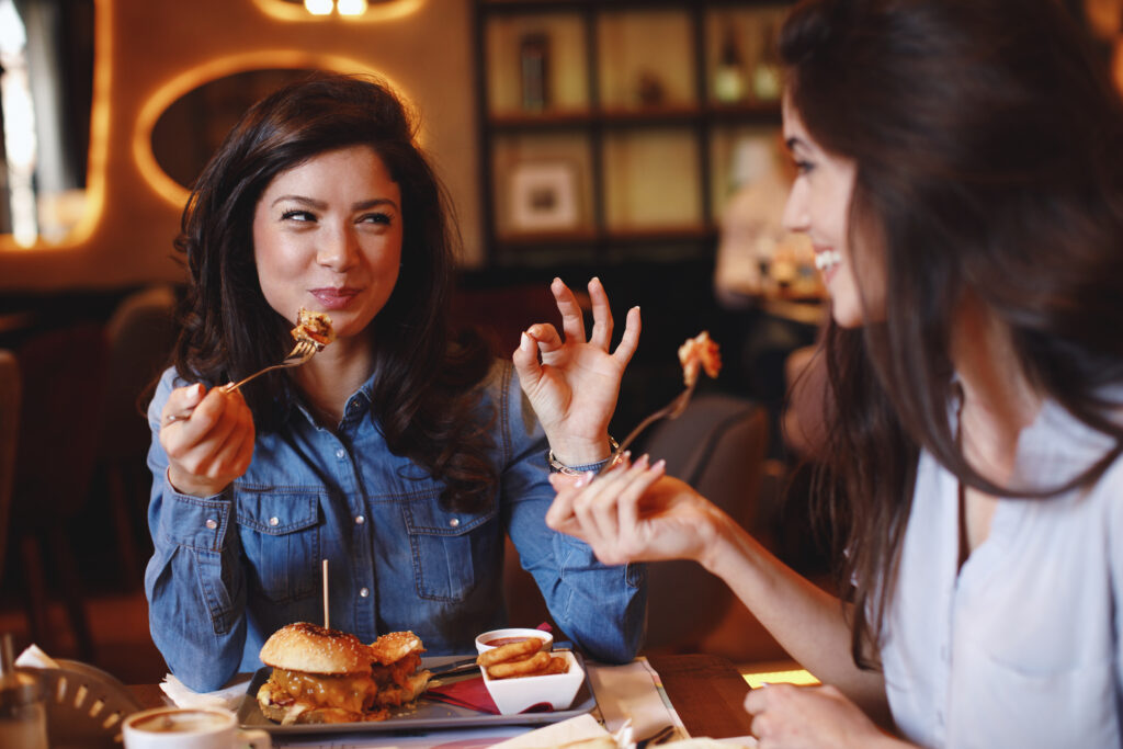 Two,Young,Women,At,A,Lunch,In,A,Restaurant
