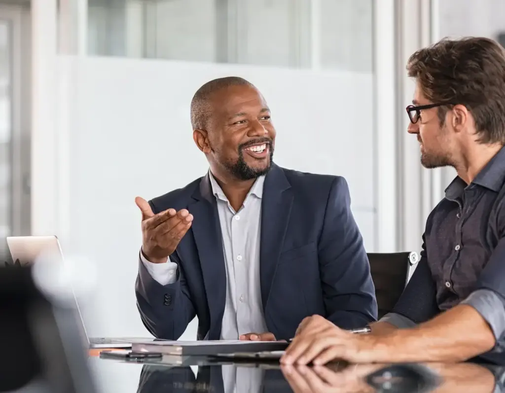 Two men have a business meeting in a conference room