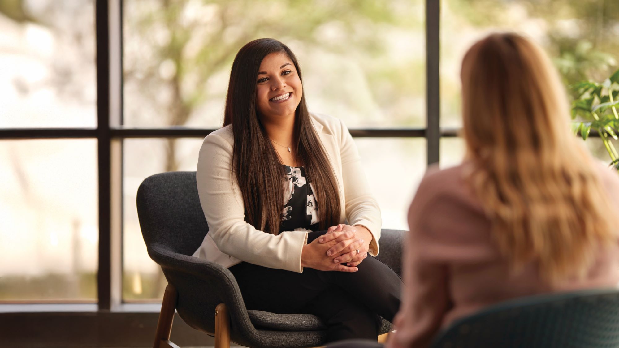 Sandy Segura speaks with a client