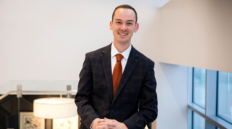 Zach Holmes standing in Bankers Trust office
