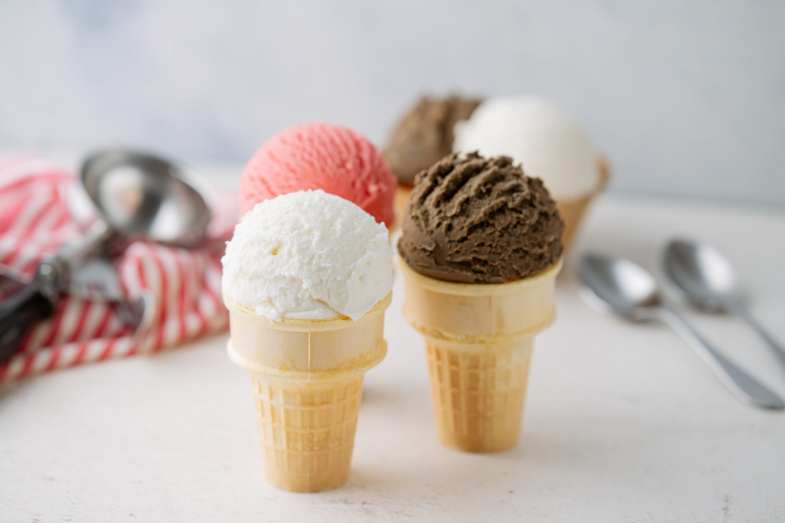 Four ice cream cones on a counter