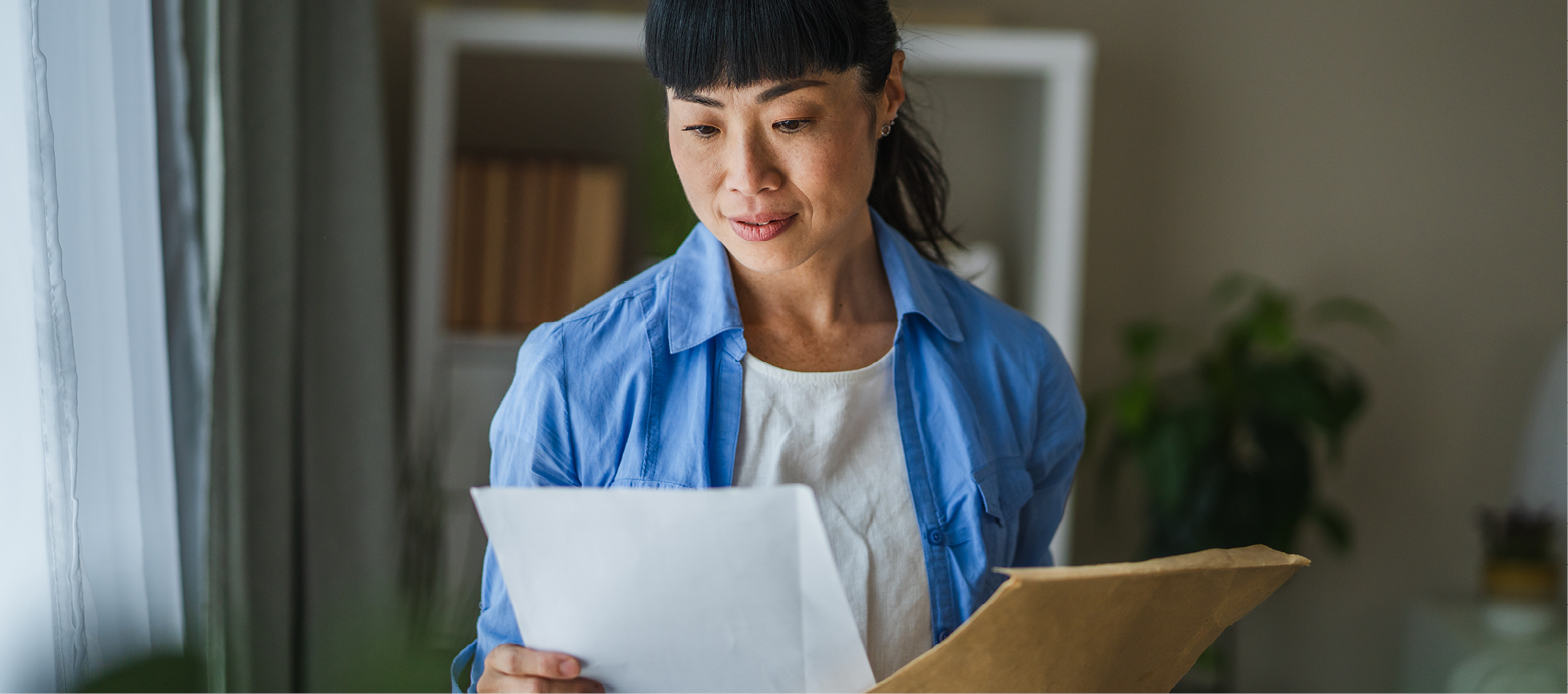 Woman looking at financial documents